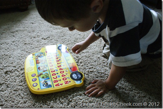 playing with bus on floor